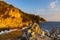 Rocks and cliffs shoreline of Cap Ferrat cape hosting Saint-Jean-Cap-Ferrat resort town on at French Riviera in France