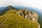 Rocks and cliffs under dark clouds trekking path at Suva Planina mountain