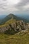 Rocks and cliffs under dark clouds trekking path at Suva Planina mountain