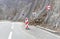 Rocks collapse on road