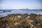 The rocks are in contact with the sea. Rocky beach, sharp rocks touching the sea, Greece island of Crete.