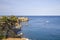 The rocks are in contact with the sea. Rocky beach, sharp rocks touching the sea, Greece island of Crete