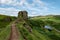 The rocks of Faerie Castle Castle Ewen at the Fairy Glen in Isle of Skye in Scotland with a muddy path