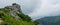 Rocks and foggy mountainside panorama