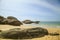 Rocks in front of the shining turquoise-blue Indian Ocean