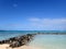 Rocks going into the water form the Pahonu Pond