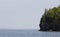 Rocks island with trees at Frenchman bay in Maine USA against a misty horizon