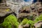 Rocks in the Masca gorge, Tenerife, showing solidified volcanic lava flow layers and arch formation. The ravine or barranco leads