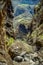 Rocks in the Masca gorge, Tenerife, showing solidified volcanic lava flow layers and arch formation. The ravine or barranco leads