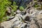 Rocks in the Masca gorge, Tenerife, showing solidified volcanic lava flow layers and arch formation. The ravine or barranco leads