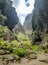 Rocks in the Masca gorge, Tenerife, showing solidified volcanic lava flow layers and arch formation. The ravine or barranco leads