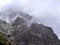 Rocks, mountains peak and clouds