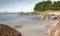 Rocks in Ocean with Trees