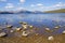 Rocks and pebbles at the waters edge of Loch Lomond