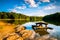Rocks and a picnic table in Lake Marburg, at Codorus State Park, Pennsylvania.