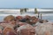 Rocks and remains of a jetty at the seaside