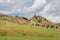 Rocks and rock cuts among the hills and steppes of Ded Khakassia in Kazanovka