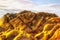 Rocks rounded against sky yellow cracks