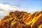 Rocks rounded against sky yellow cracks