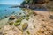 Rocks and sand in Lazzaretto shore in springtime