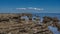 The rocks of the seabed were exposed at low tide.