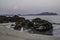 rocks in the shallows of the beach in the morning