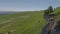 Rocks on the slope of a green hill. Aerial view