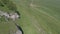 Rocks on the slope of a green hill. Aerial view