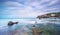 Rocks and soft sea, long exposure photography landscape. Castiglioncello, Italy