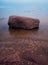 Rocks standing out of the water.