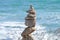 Rocks or stone balancing tower with sea background