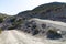 Rocks and stones on the off-road trail to the top of Attavyros mountain. Dry climate. Rhodes island, Greece.