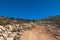 Rocks and stones on the off-road trail to the top of Attavyros mountain. Dry climate. Rhodes island, Greece.