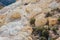 Rocks with sulfur crystals at Nisyros volcano Stefanos crater Greece