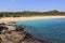 Rocks and tropical sandy beach Kuta, Lombok