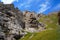 Rocks under blue sky with clouds near to Kelsu