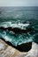 Rocks and waves in the Pacific Ocean, seen from La Jolla, California.