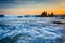 Rocks and waves in the Pacific Ocean at sunset