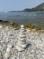 Rocks , yacht and mountains in the Mediterranean sea  , shot made at the beach on Sveti Nikola island in Budva, Montenegro