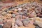 Rocky algarve coast with colorful stones, yellow red and grey