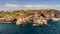 Rocky Arch in the sea, view from sea. Popular tourist destinations. Amazing natural wonder. Mirador Es Pontas, Samtanyi