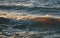 Rocky autumn beach with waves crashing on the rocks - vintage re