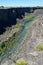 Rocky banks Malad River Devil`s Washbowl Malad Gorge Hagerman Idaho vertical