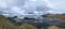 A rocky beach with bergs on Iceland in strong winds with powerful surf