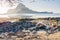 Rocky Beach during low tide in morning light in front of amazing Cadlao Island, El-Nido, Palawan, Philippines