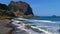 Rocky beach Praia da Maiata on the Atlantic coast near village Porto da Cruz in the north of Madeira, Portugal.