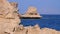 Rocky beach on red sea with cliff near the coral reef. Egypt. Resort on red sea coast.