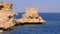 Rocky beach on red sea with cliff near the coral reef. Egypt. Resort on Red Sea Coast.