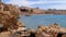 Rocky Beach on Red Sea near the Coral Reef. Egypt. Resort on Red Sea Coast.