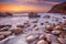 Rocky beach at sunset, Porth Nanven, Cornwall, England